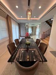 Modern dining room with elegant furnishings and lighting