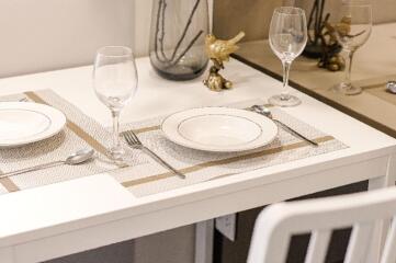 Table set for two in a dining area with elegant tableware