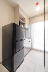 Modern kitchen with black refrigerator