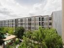 Exterior view of residential building with surrounding greenery