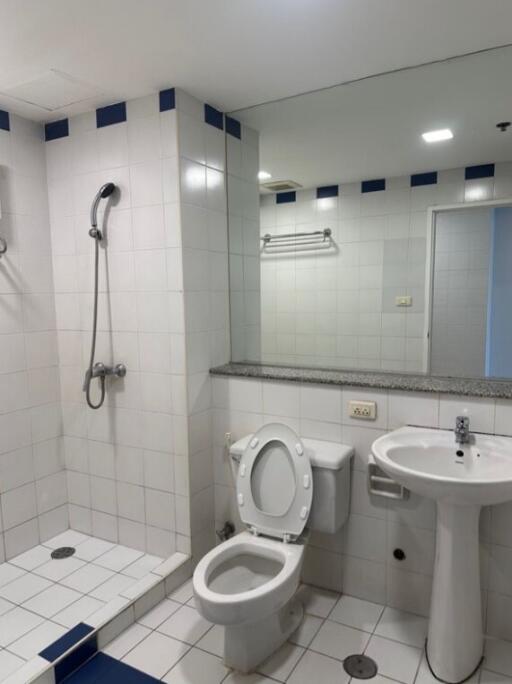 Modern bathroom with shower, toilet, and sink