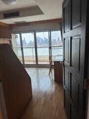 View from doorway into living area with cityscape in background