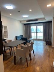 Modern living room with dining area and city view