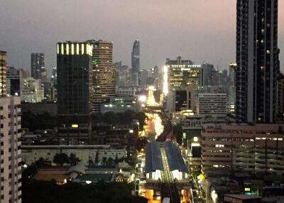 Evening city view with buildings and traffic