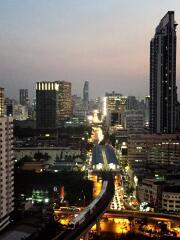 Evening city view with buildings and traffic