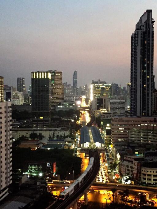 Evening city view with buildings and traffic