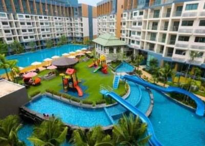 Large residential complex with outdoor pool and playground