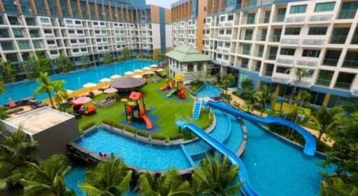 Large residential complex with outdoor pool and playground