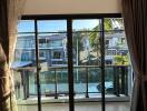 Bedroom with large sliding glass doors and balcony view