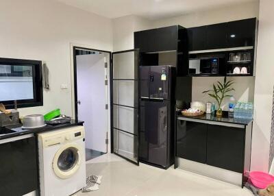 Modern kitchen with appliances and washing machine