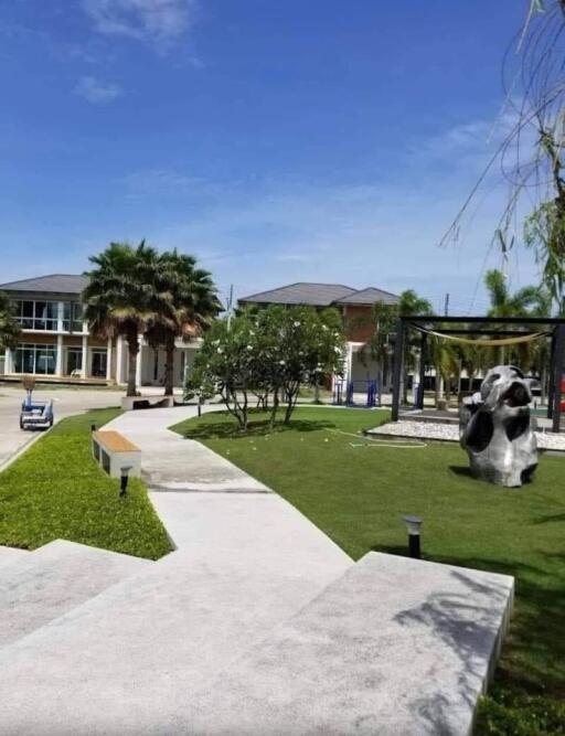 Outdoor view with buildings, pathway, and greenery