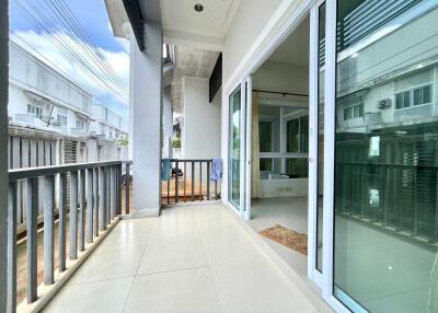 Spacious balcony with sliding glass doors