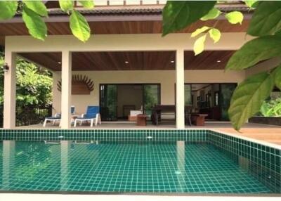 Covered patio area with swimming pool