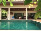 Covered patio area with swimming pool