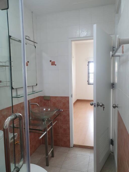 Bathroom with glass washbasin and shower