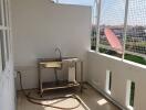 Balcony with stainless steel sink and open views