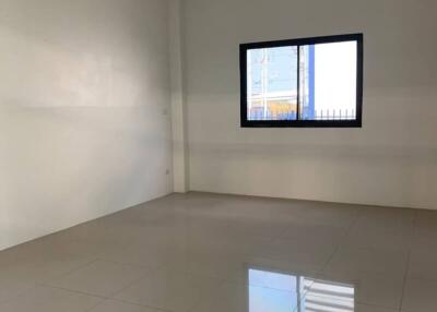 Empty room with tiled floor and window