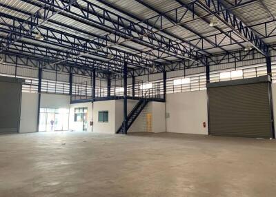 Spacious warehouse interior with mezzanine and industrial features