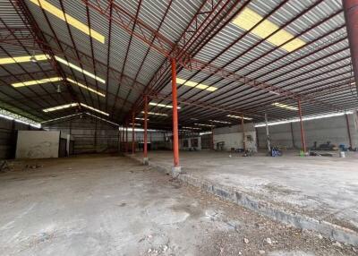 Spacious industrial warehouse with high ceilings and metal construction