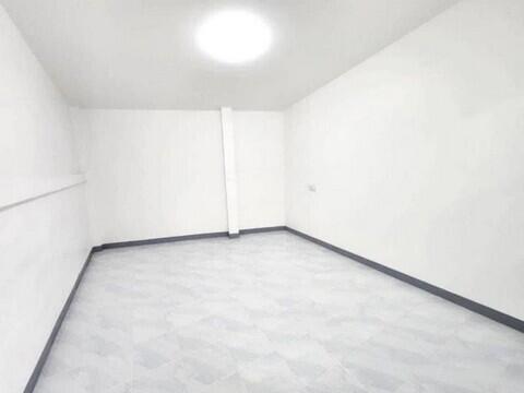 Empty white room with tile floor