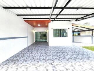 Covered outdoor porch with tiled floor and lighting