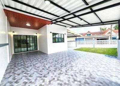 Covered outdoor space with tiled flooring