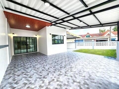 Covered outdoor space with tiled flooring