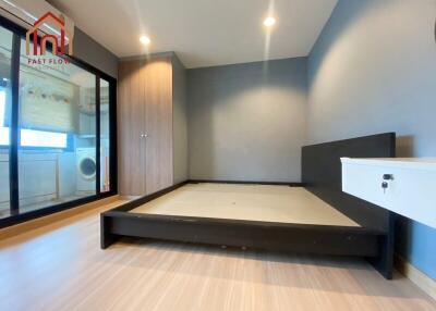 Modern bedroom with large bed frame and built-in wardrobe