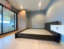 Modern bedroom with large bed frame and built-in wardrobe