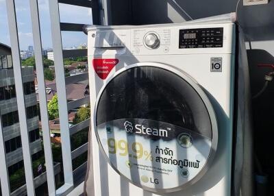 Outdoor laundry area with a modern washing machine