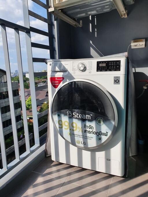 Outdoor laundry area with a modern washing machine