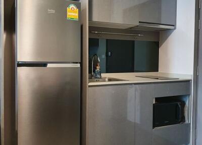 Modern kitchen with grey cabinets and stainless steel appliances