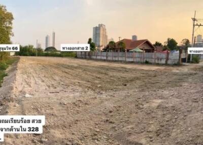 Vacant land with cityscape in background