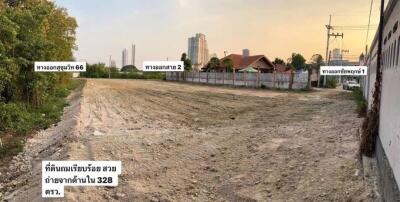 Vacant land with cityscape in background