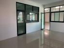 Spacious unfurnished office or room with large windows and glossy floor tiles