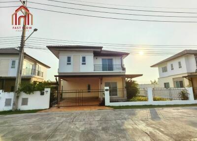 Front view of a modern two-story house with a balcony