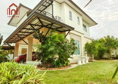 Modern two-story house with garden