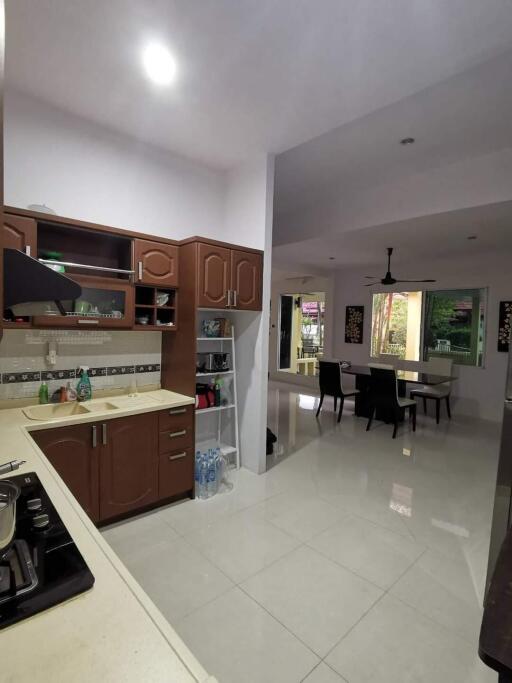 Modern open kitchen view leading to dining area