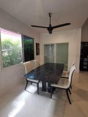 Modern dining room with black table and white chairs