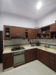 Modern kitchen with wooden cabinets and appliances