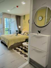 Well-furnished modern bedroom with a cozy bed and decorative furnishings