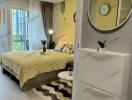 Well-furnished modern bedroom with a cozy bed and decorative furnishings