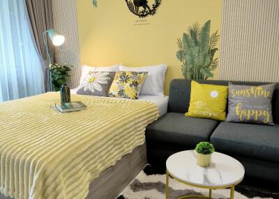 Cozy and stylishly decorated bedroom with yellow and green accents