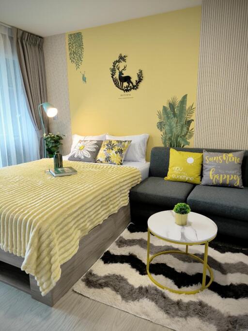 Cozy and stylishly decorated bedroom with yellow and green accents