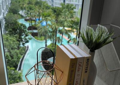 View from balcony overlooking pool and garden area