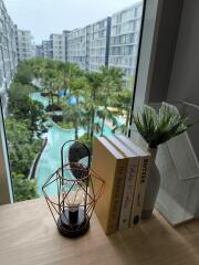 View from balcony overlooking pool and garden area