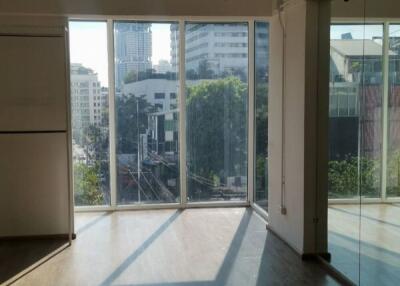 Living room with large windows and city view