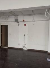 Empty living space with exposed wiring