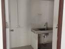 Utility room with sink and tiled floor