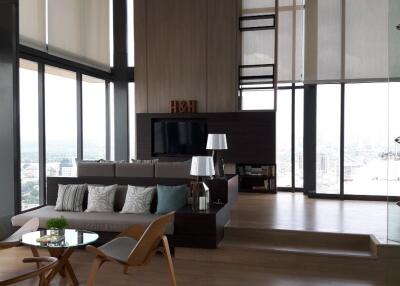 Modern high-rise living room with large windows and city view